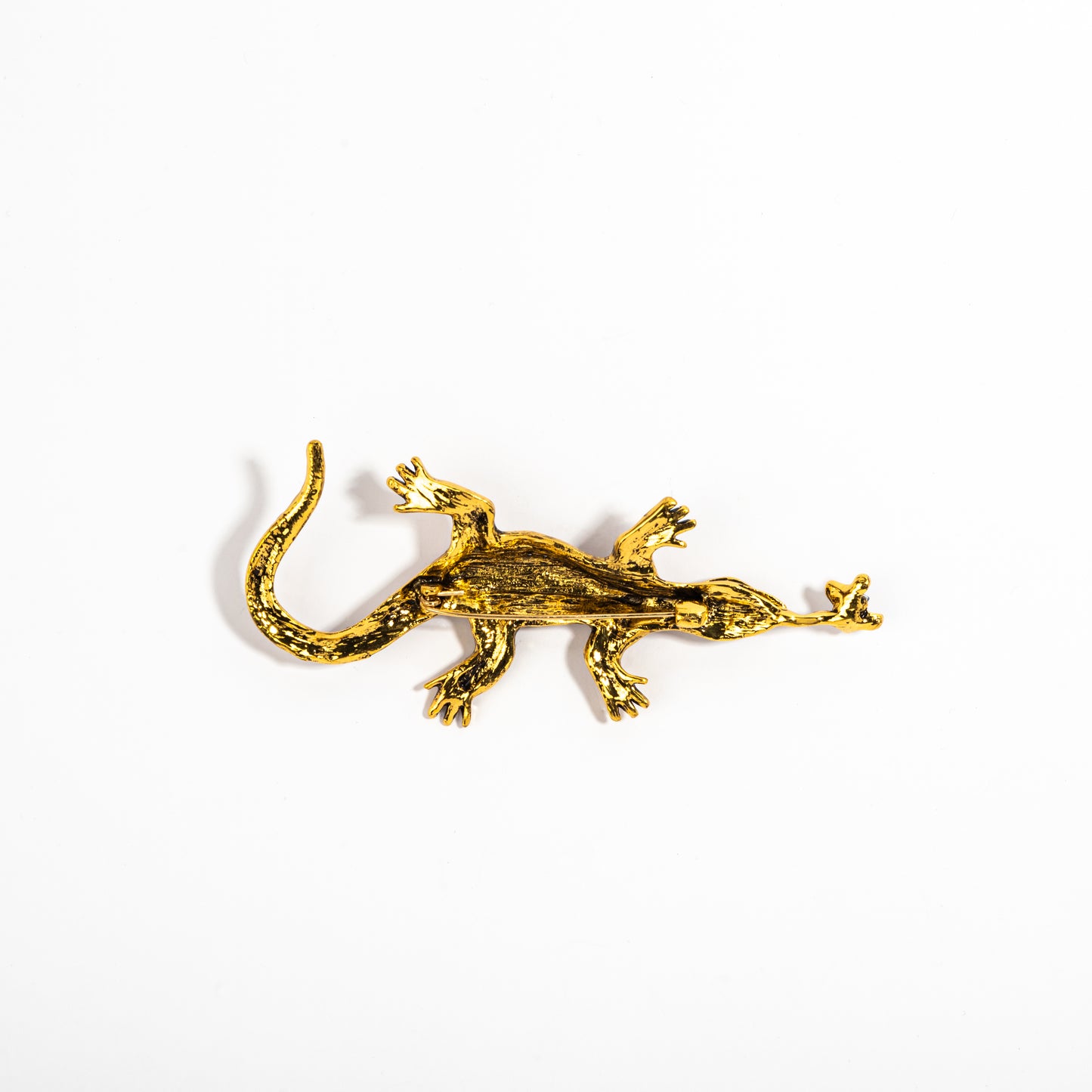 Golden lizard brooch