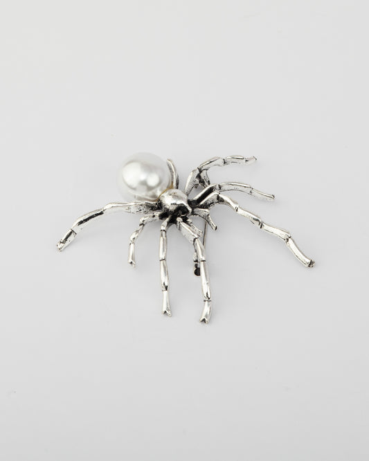 The silver spinner brooch